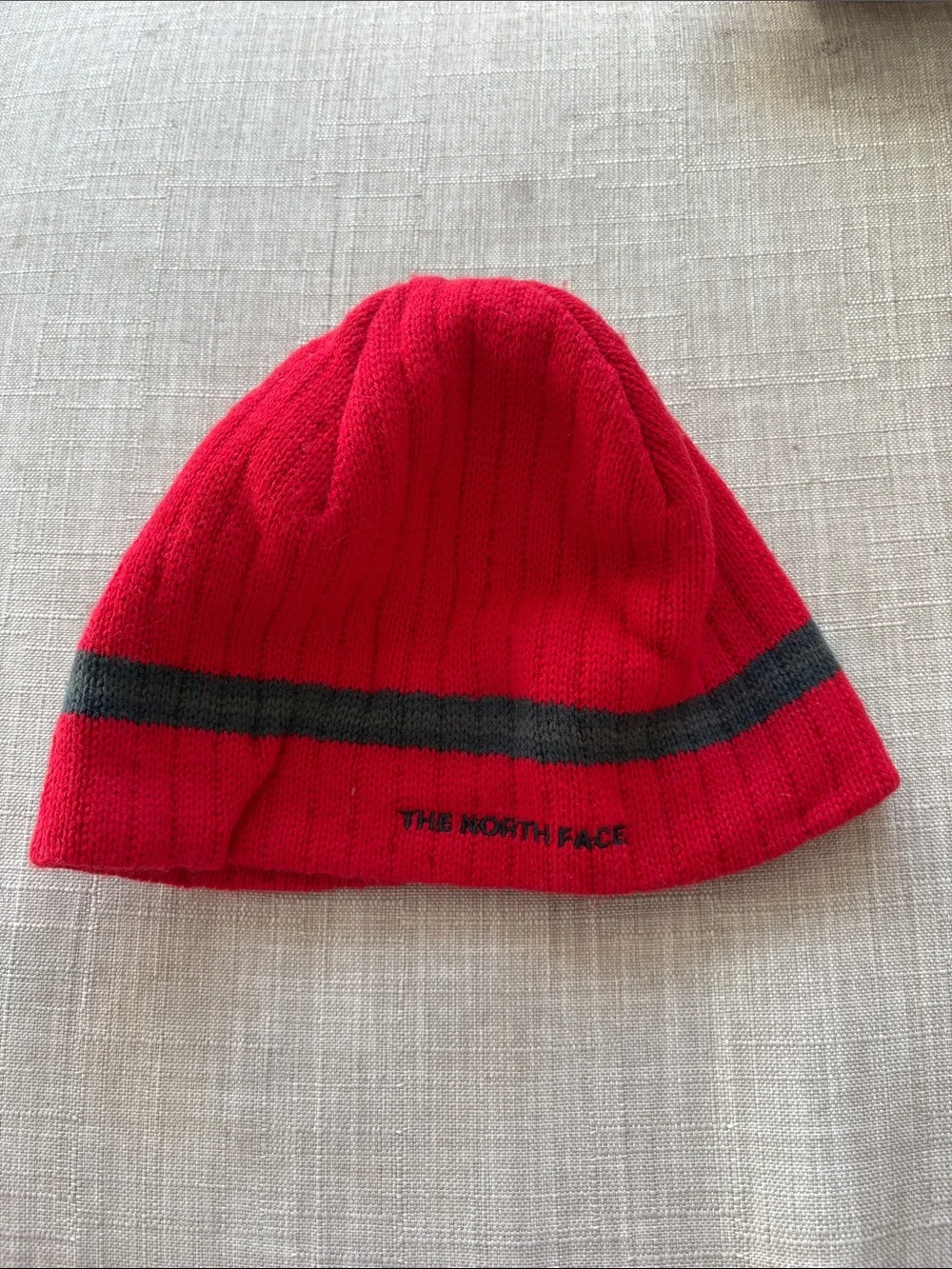 The North Face Red Beanie with Dark Gray Stripe